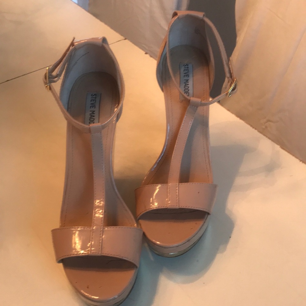 Steve Madden beige patent t-strap platforms.